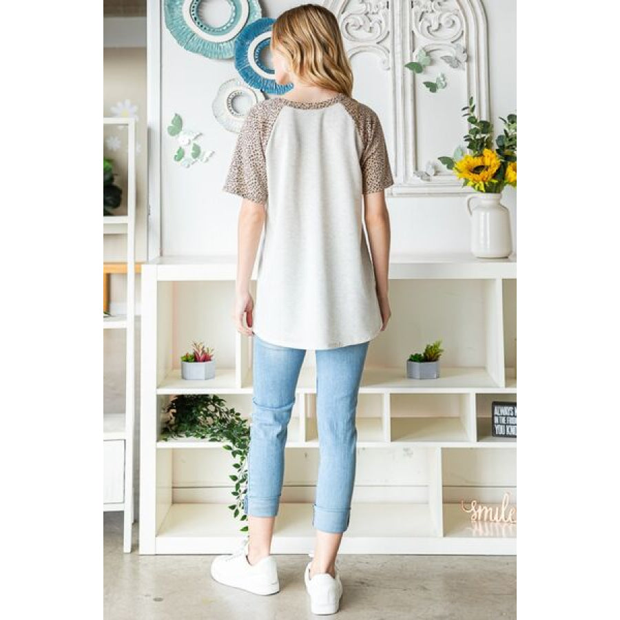 Heimish Full Size Animal Print Half Button Short Sleeve Top Apparel and Accessories