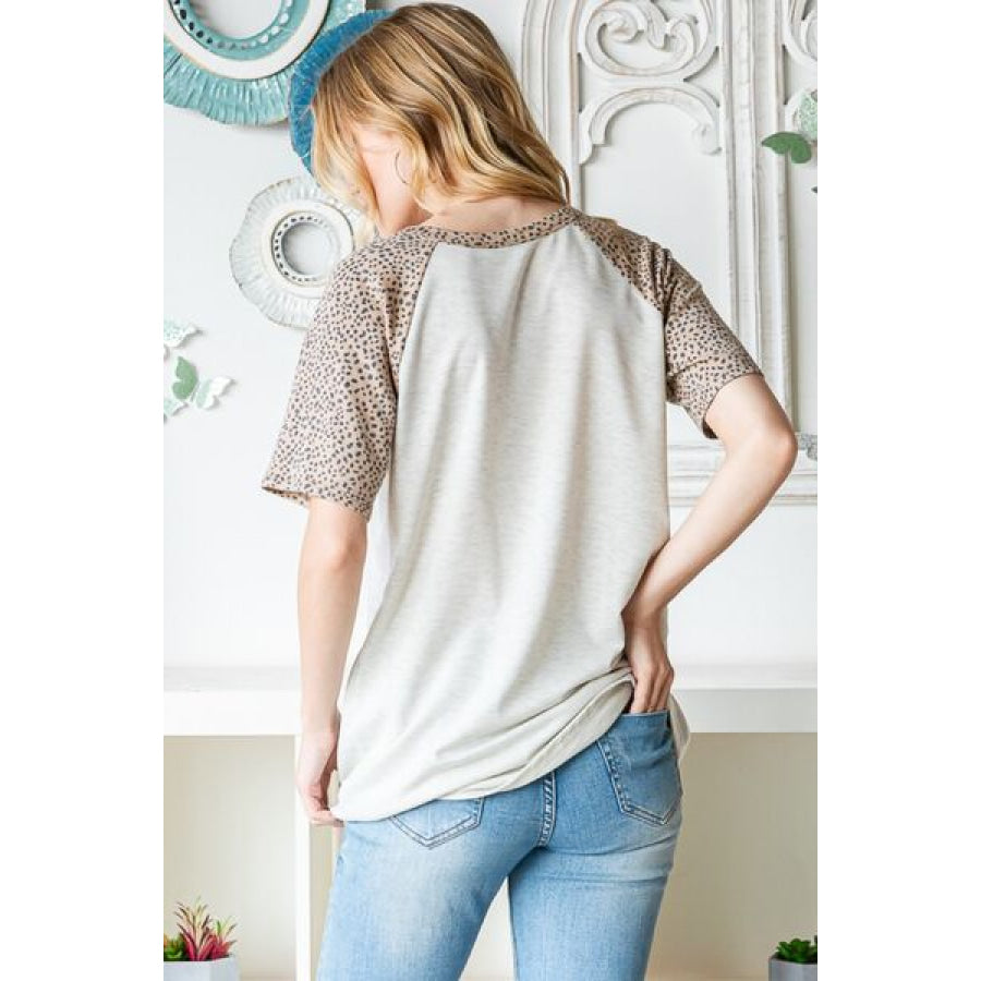 Heimish Full Size Animal Print Half Button Short Sleeve Top Apparel and Accessories