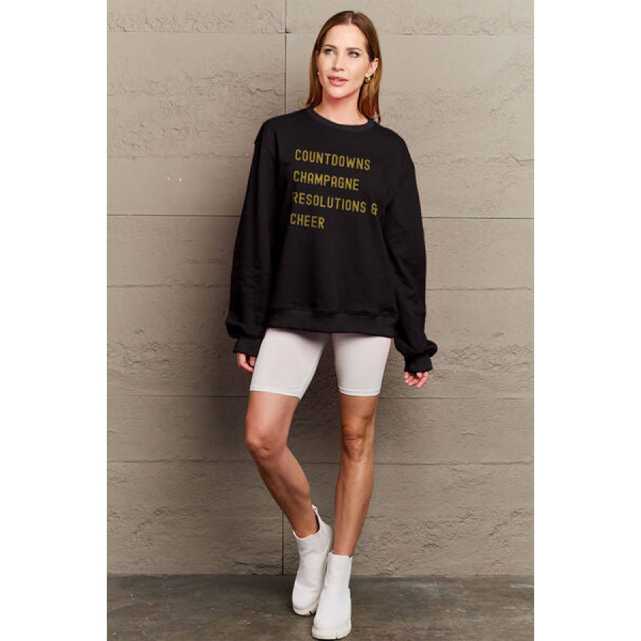 Simply Love Full Size COUNTDOWNS CHAMPAGNE RESOLUTIONS & CHEER Round Neck Sweatshirt Apparel and Accessories