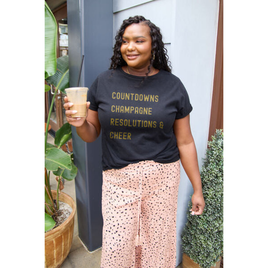 Simply Love Full Size COUNTDOWNS CHAMPAGNE RESOLUTIONS & CHEER Round Neck T-Shirt Apparel and Accessories