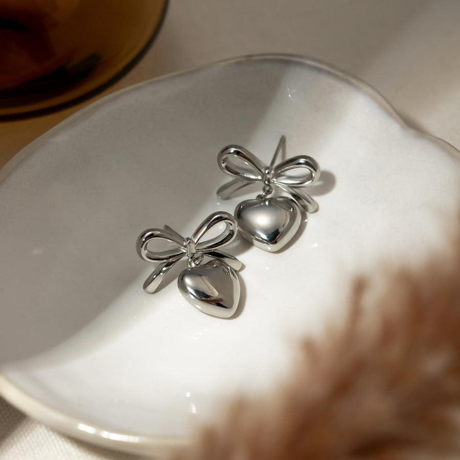 Stainless Steel Bow & Heart Drop Earrings Silver / One Size Apparel and Accessories