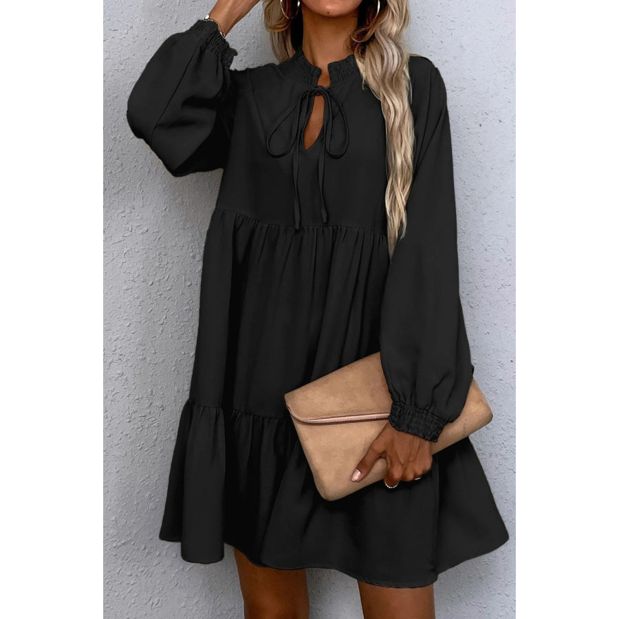 Black Tie Split Neck Smocked Detail Long Puff Sleeve Ruffle Hem Loose Dress Black / S / 100% Polyester Dresses/Mini Dresses