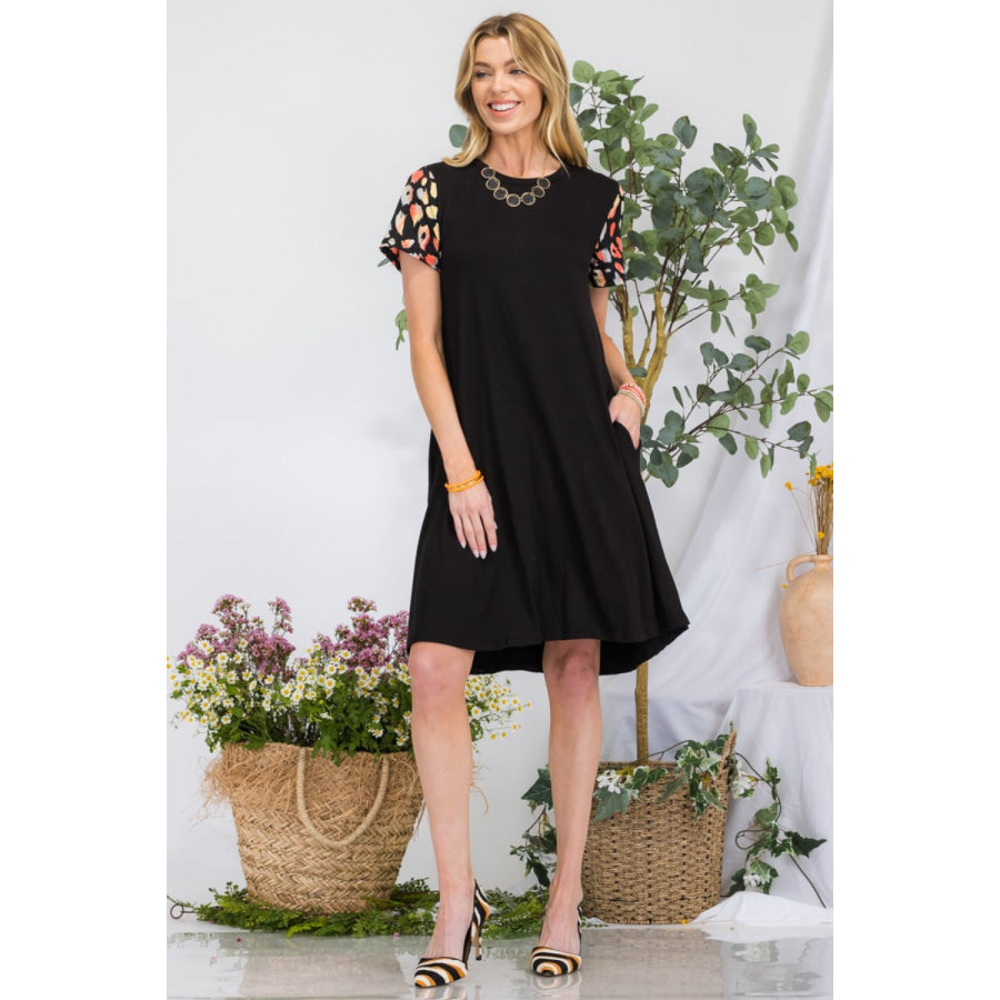 Celeste Full Size Leopard Short Sleeve Dress with Pockets Black / S Apparel and Accessories