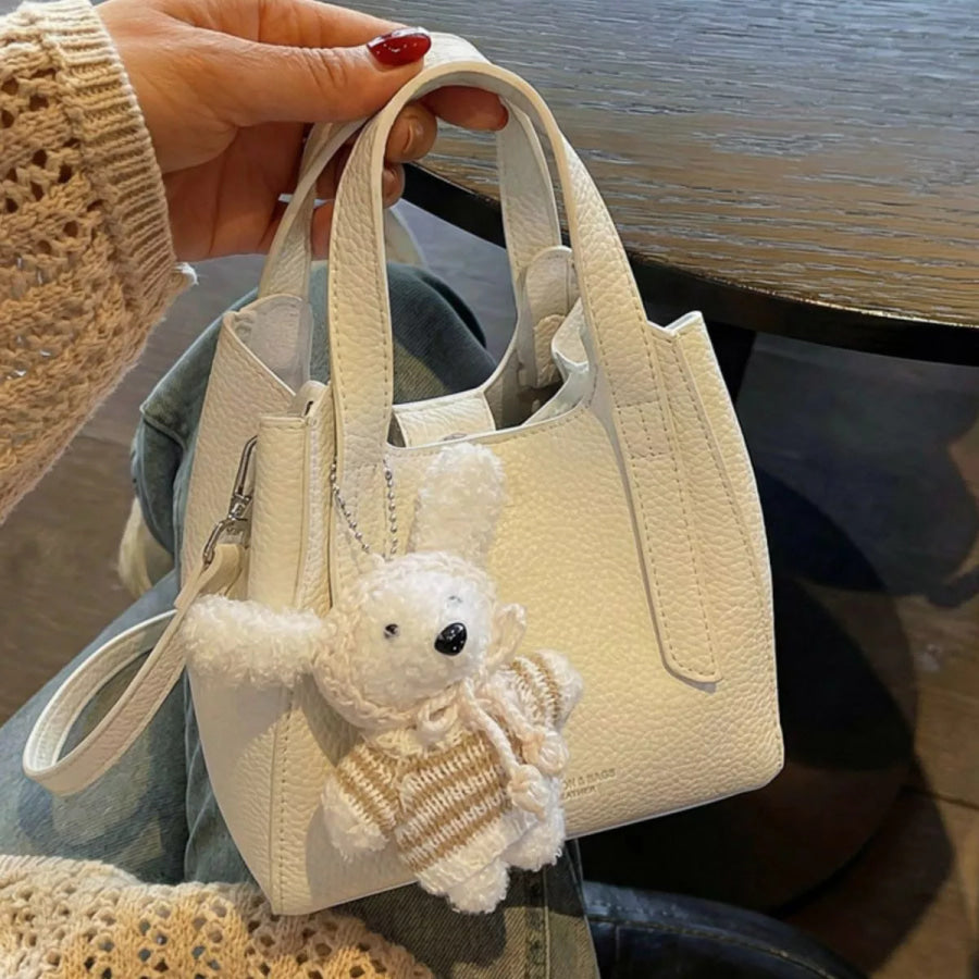 Chic Textured Leather Crossbody Bag with Adorable Charm Ivory / One Size Apparel and Accessories