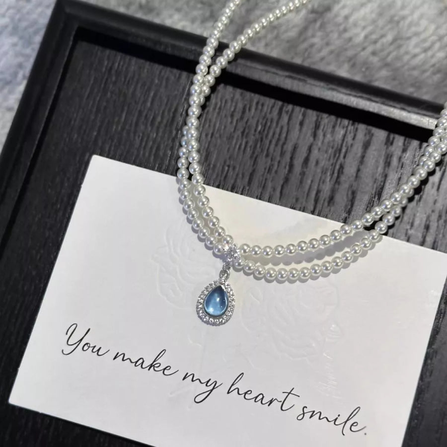 Double Layered Pearl Necklace with Teardrop Pendant Pastel Blue / One Size Apparel and Accessories