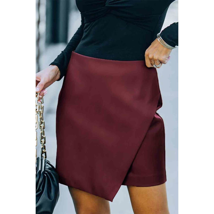 Double Take Asymmetrical PU Leather Mini Skirt Wine / S Apparel and Accessories