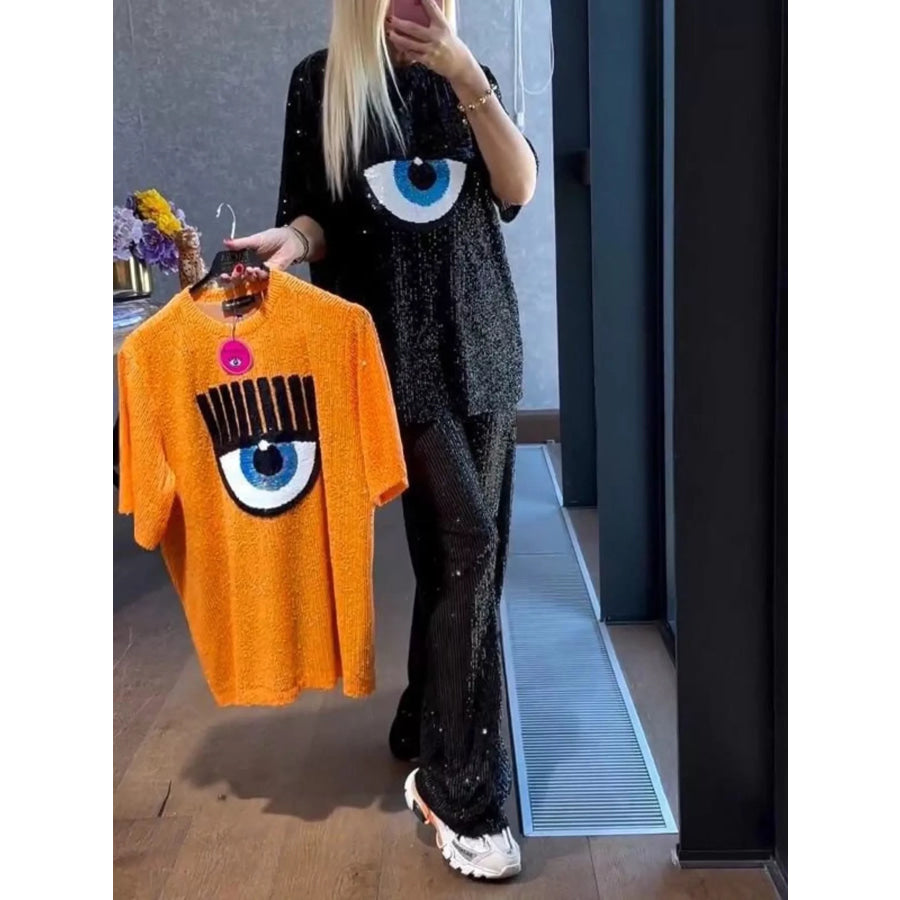 Full Size Eye-Pattern Round Neck Top and Pants Two-Piece Set Plus Size Black / S Apparel and Accessories