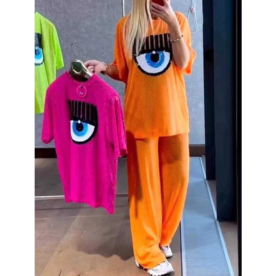 Full Size Eye-Pattern Round Neck Top and Pants Two-Piece Set Plus Size Orange Red / S Apparel and Accessories