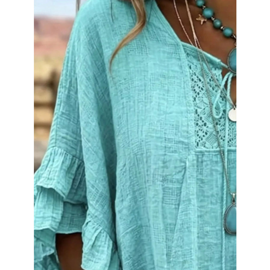 Full Size Tassel Tie Neck Ruffled Hem Blouse Plus Apparel and Accessories
