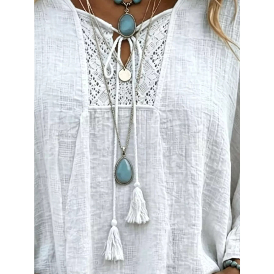 Full Size Tassel Tie Neck Ruffled Hem Blouse Plus Apparel and Accessories