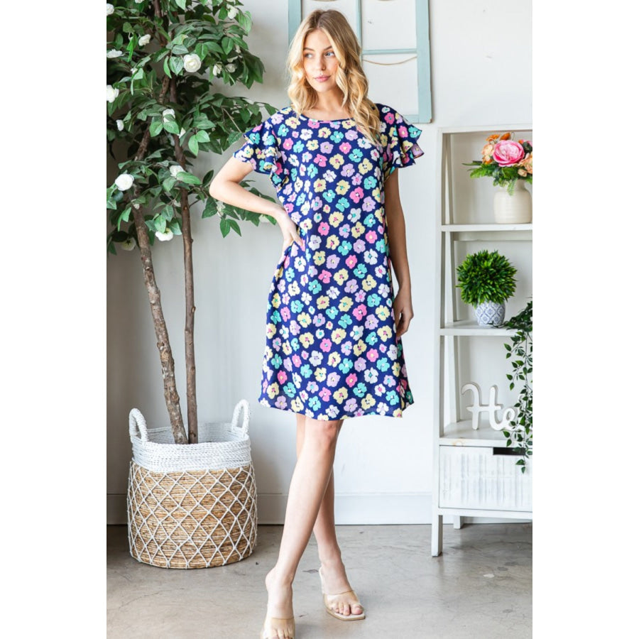 Heimish Full Size Floral Ruffled Short Sleeve Dress with Pockets Navy / S Apparel and Accessories