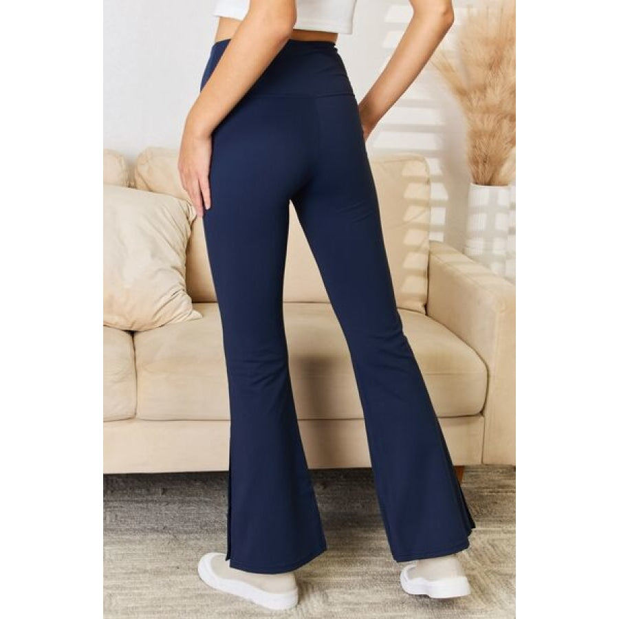 Kimberly C Full Size Wide Waistband Slit Flare Pants Navy / S Apparel and Accessories