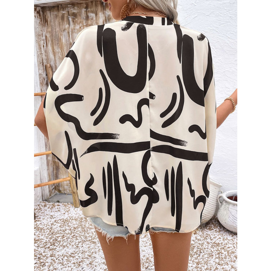 Perfee Printed Notched Half Sleeve Blouse Apparel and Accessories