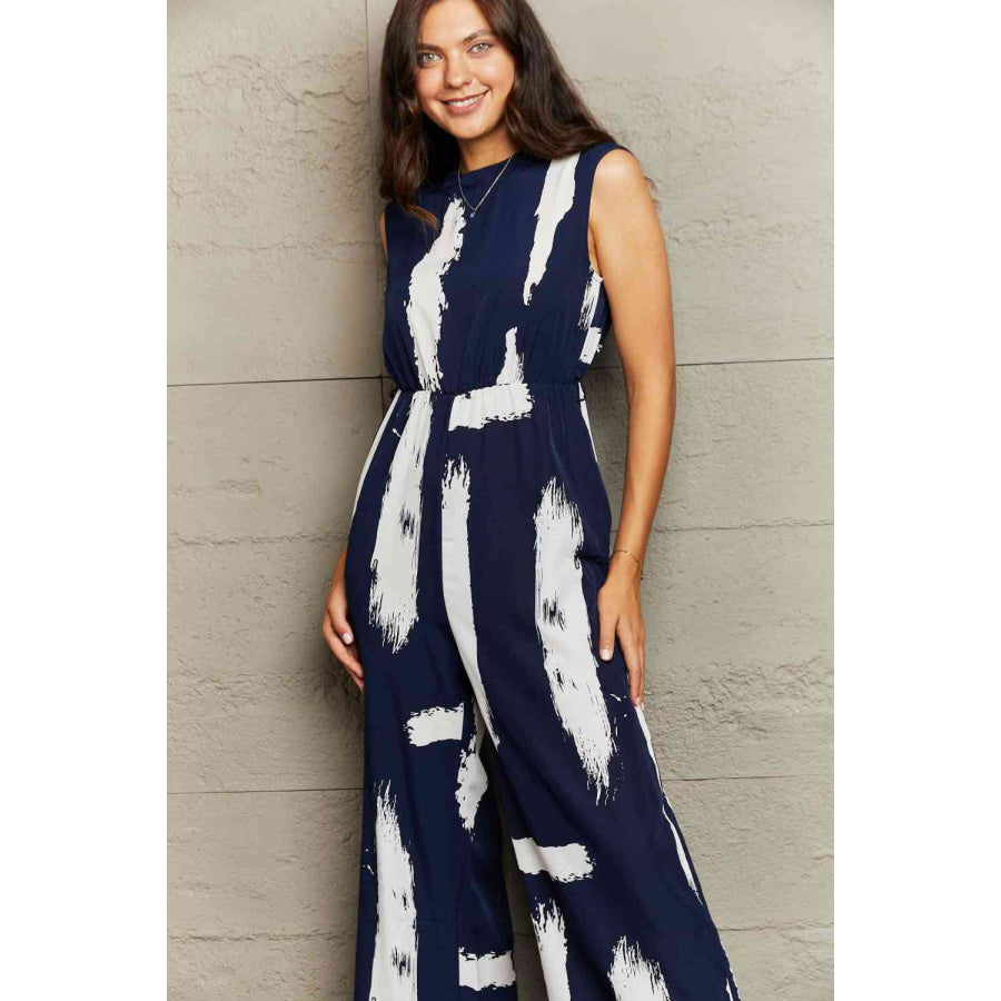 Printed Round Neck Cutout Jumpsuit with Pockets Apparel and Accessories