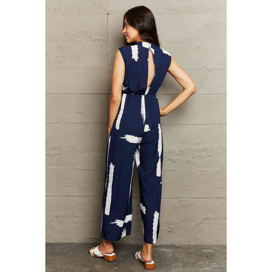 Printed Round Neck Cutout Jumpsuit with Pockets Navy / S Apparel and Accessories