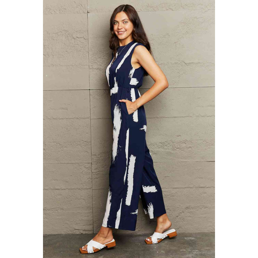 Printed Round Neck Cutout Jumpsuit with Pockets Apparel and Accessories