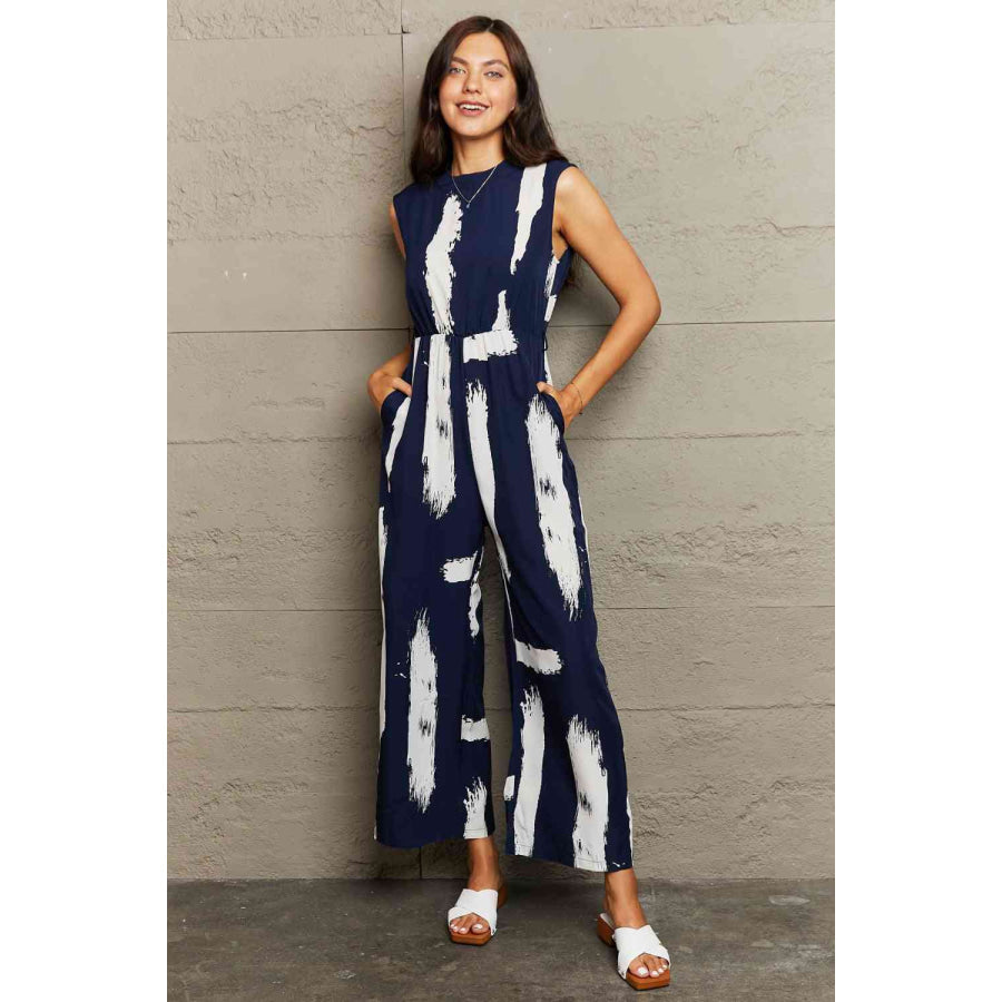Printed Round Neck Cutout Jumpsuit with Pockets Navy / S Apparel and Accessories