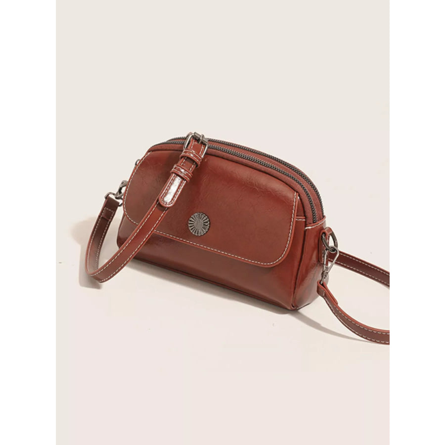 PU Leather Crossbody Bag with Metal Emblem Detail Brown / onesize Apparel and Accessories