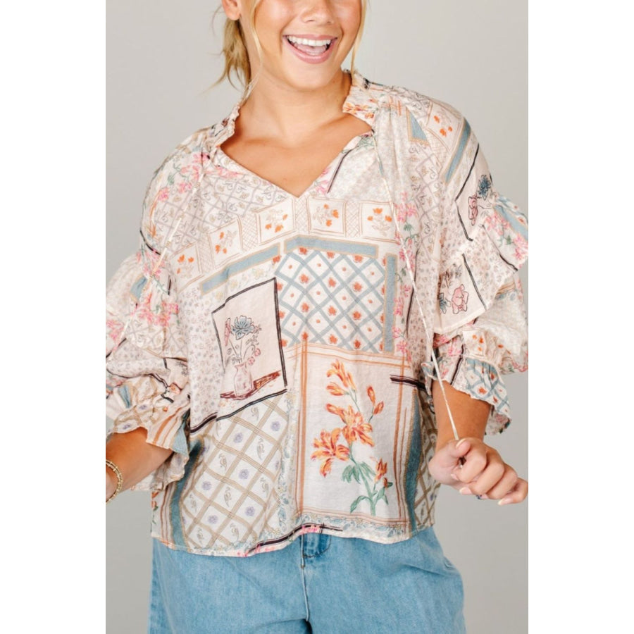 Ruffled Printed Tie Neck Three-Quarter Sleeve Blouse Floral / S Apparel and Accessories