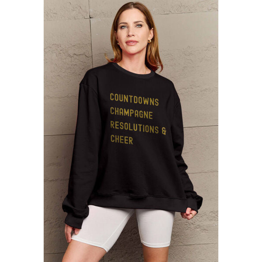 Simply Love Full Size COUNTDOWNS CHAMPAGNE RESOLUTIONS &amp; CHEER Round Neck Sweatshirt Black / S Apparel and Accessories