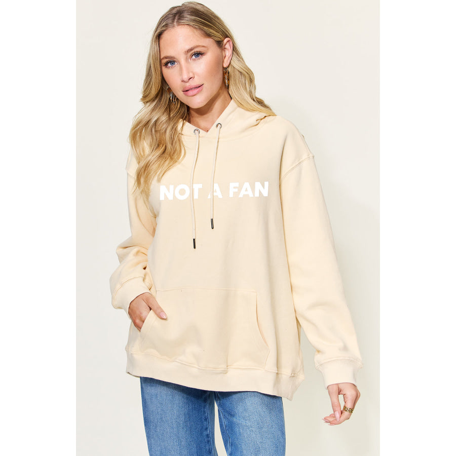 Simply Love Full Size NOT A FAN Graphic Drawstring Long Sleeve Hoodie Khaki / S Apparel and Accessories