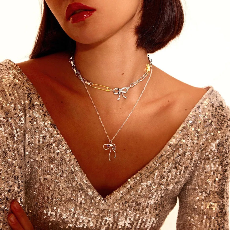 Two-Tone Bow Star Necklace Silver / One Size Apparel and Accessories