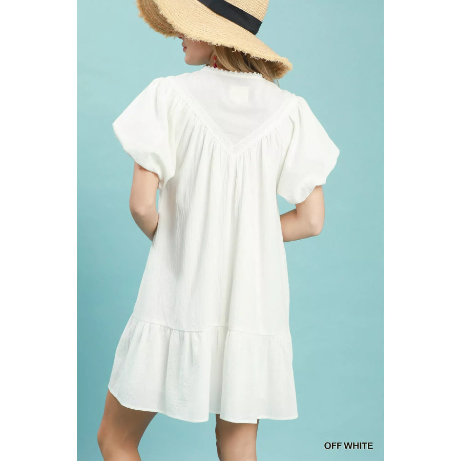 Umgee Flutter Sleeve Tassel Tie Ruffle Hem Mini Dress Apparel and Accessories