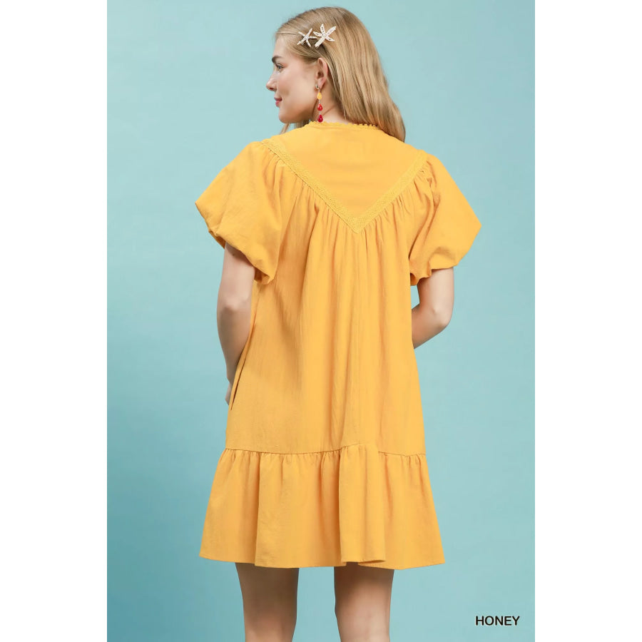 Umgee Flutter Sleeve Tassel Tie Ruffle Hem Mini Dress Apparel and Accessories